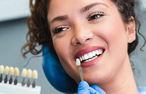 woman receiving dental implant in Wichita